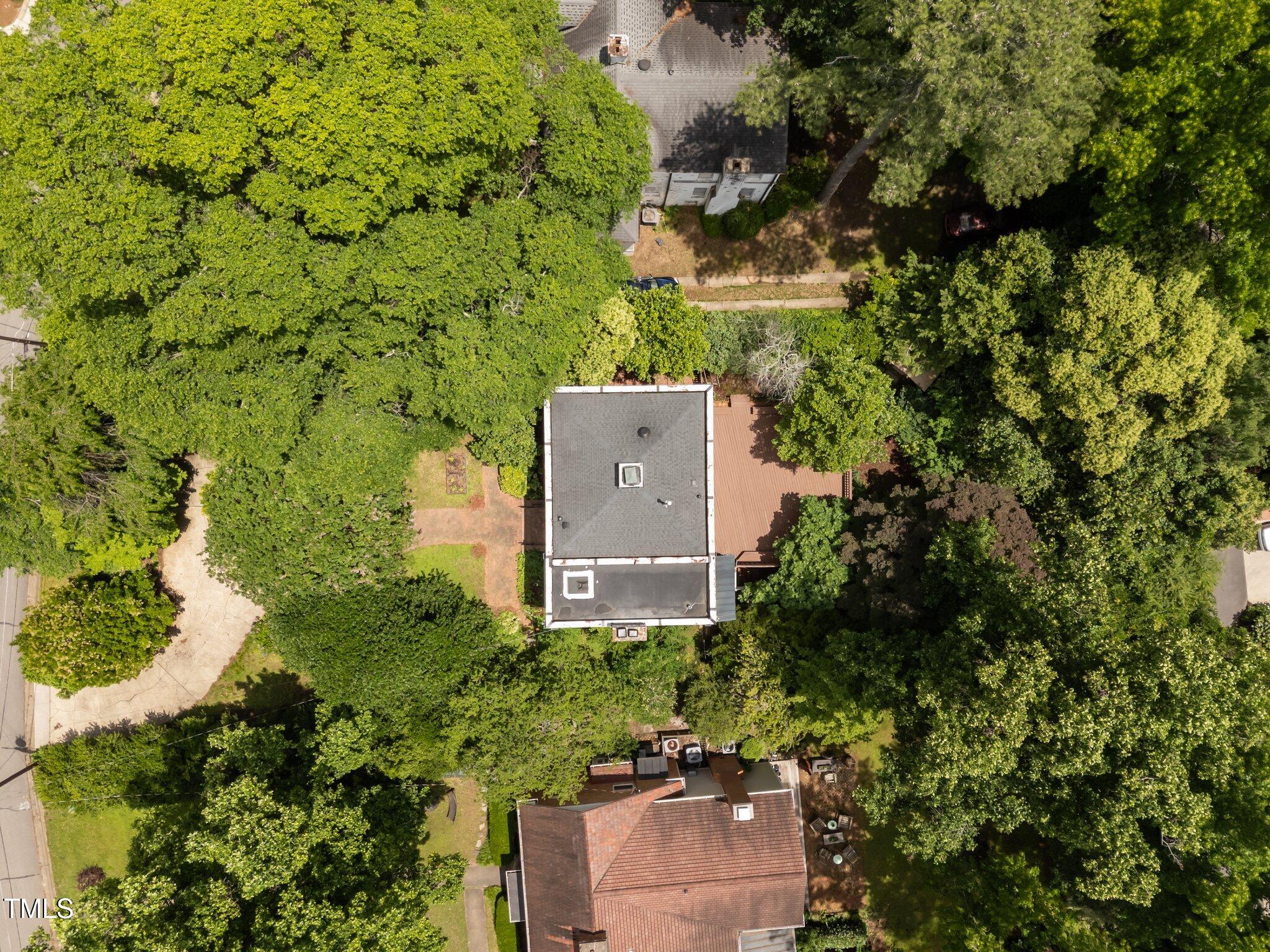 2625 Dover Road Raleigh, NC 27608 - Photo 36 of 57 an aerial view of a house with a yard and outdoor seating