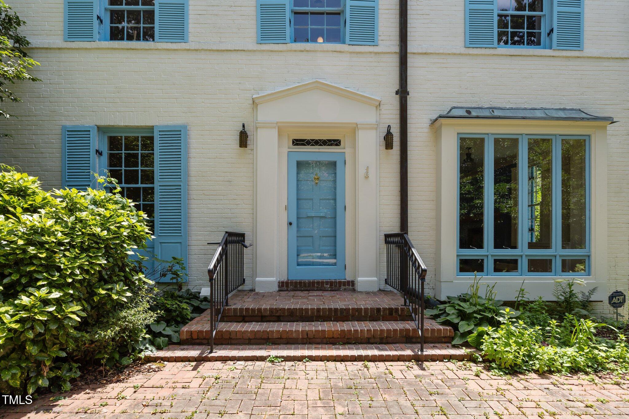 2625 Dover Road Raleigh, NC 27608 - Photo 39 of 57 a front view of a house with potted plants