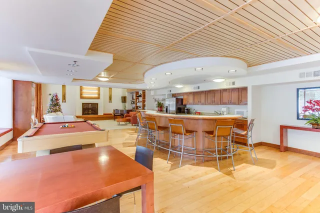 a view of a kitchen with dining table and chairs