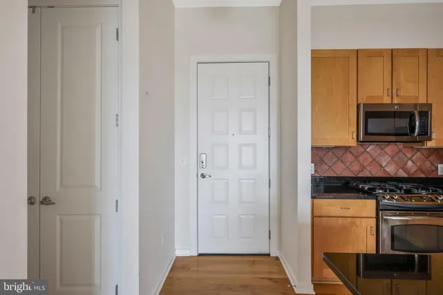 a kitchen with a stove and a microwave
