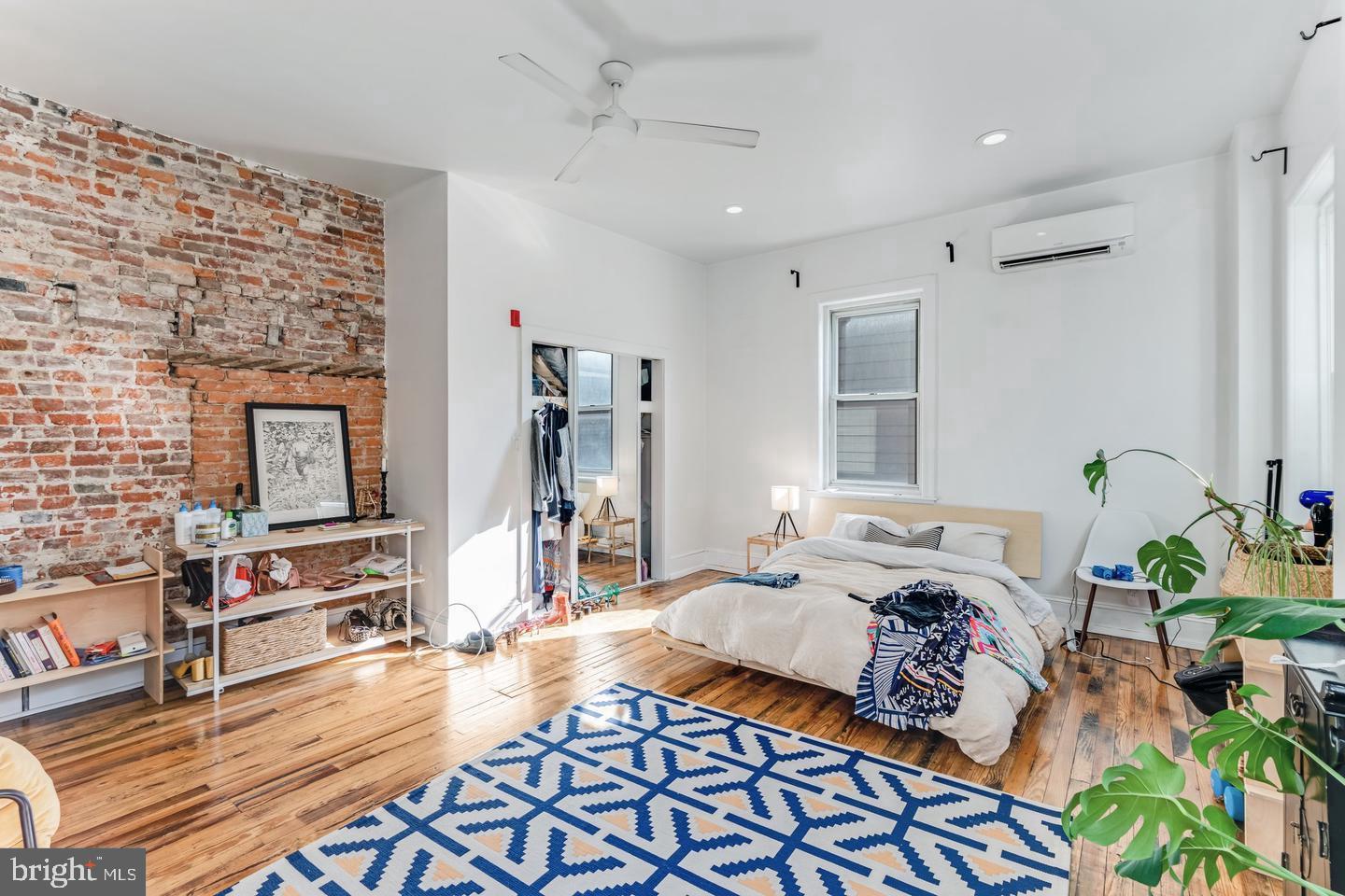 519 South 5th Street Philadelphia, PA 19147 - Photo 11 of 17 a bedroom with furniture and a wooden floor