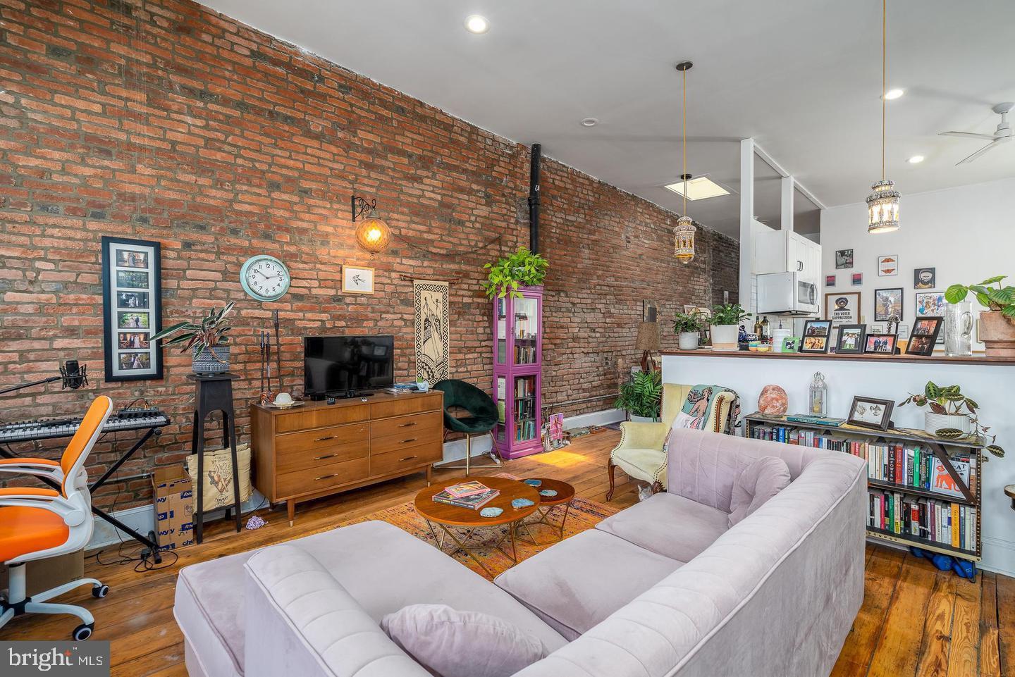 519 South 5th Street Philadelphia, PA 19147 - Photo 14 of 17 a living room with furniture and a flat screen tv