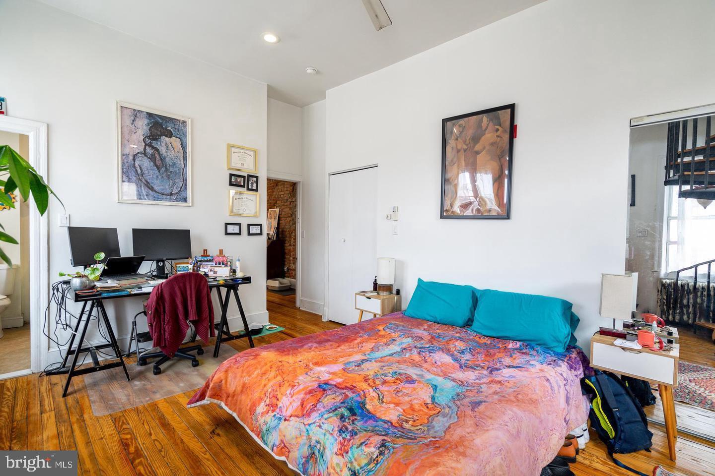 519 South 5th Street Philadelphia, PA 19147 - Photo 17 of 17 a bedroom with a bed and a table in it with window