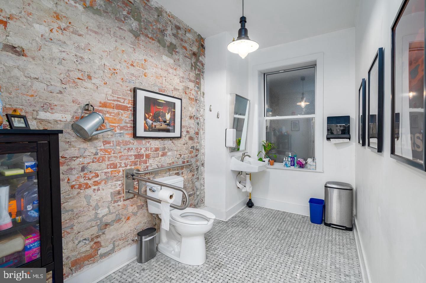 519 South 5th Street Philadelphia, PA 19147 - Photo 5 of 17 a bathroom with a toilet sink and mirror