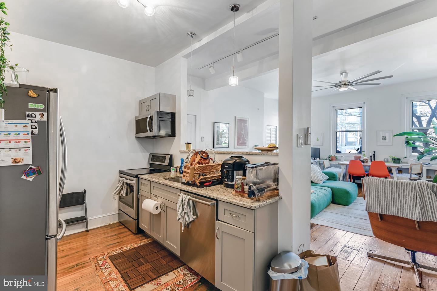 519 South 5th Street Philadelphia, PA 19147 - Photo 9 of 17 a kitchen with a sink stove and cabinets