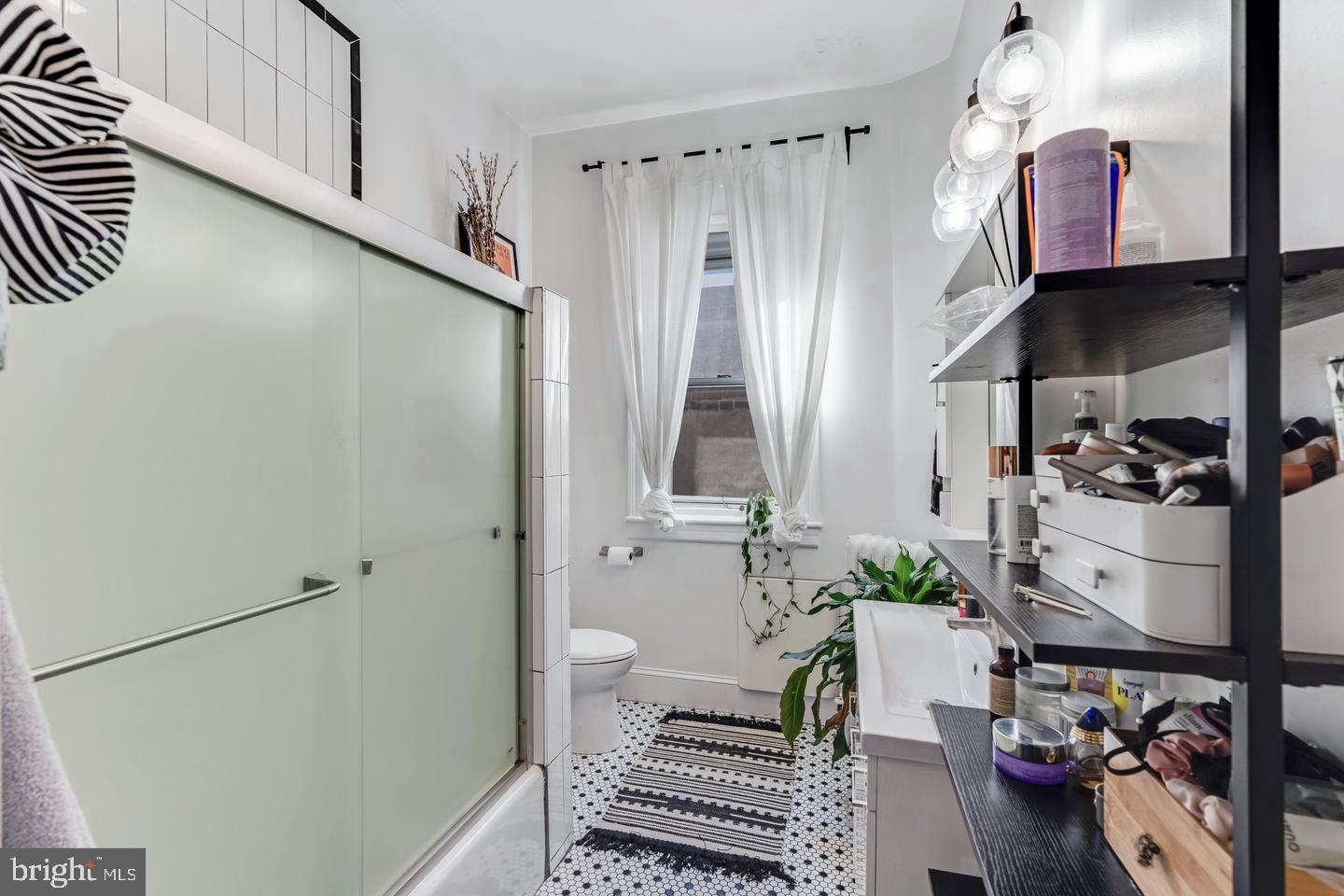 519 South 5th Street Philadelphia, PA 19147 - Photo 10 of 17 a bathroom with a sink and a mirror
