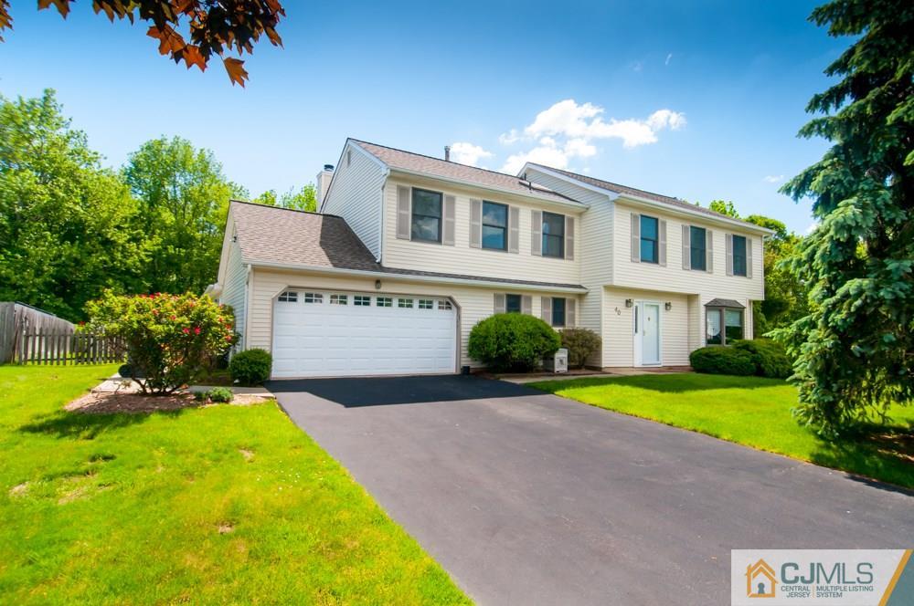 40 Higgins Road Old Bridge, NJ 08857 - Photo 2 of 46 a front view of a house with a yard and trees
