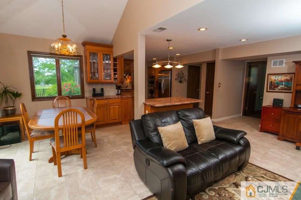 40 Higgins Road Old Bridge, NJ 08857 - Photo 15 of 46 a living room with furniture and a chandelier