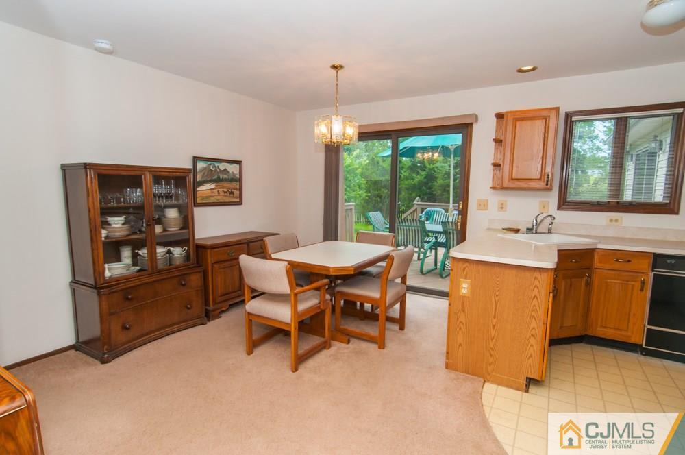 40 Higgins Road Old Bridge, NJ 08857 - Photo 22 of 46 a dining room with furniture and a window