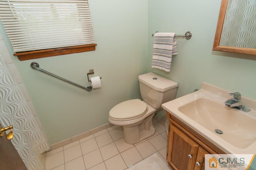 40 Higgins Road Old Bridge, NJ 08857 - Photo 25 of 46 a bathroom with a sink and a toilet