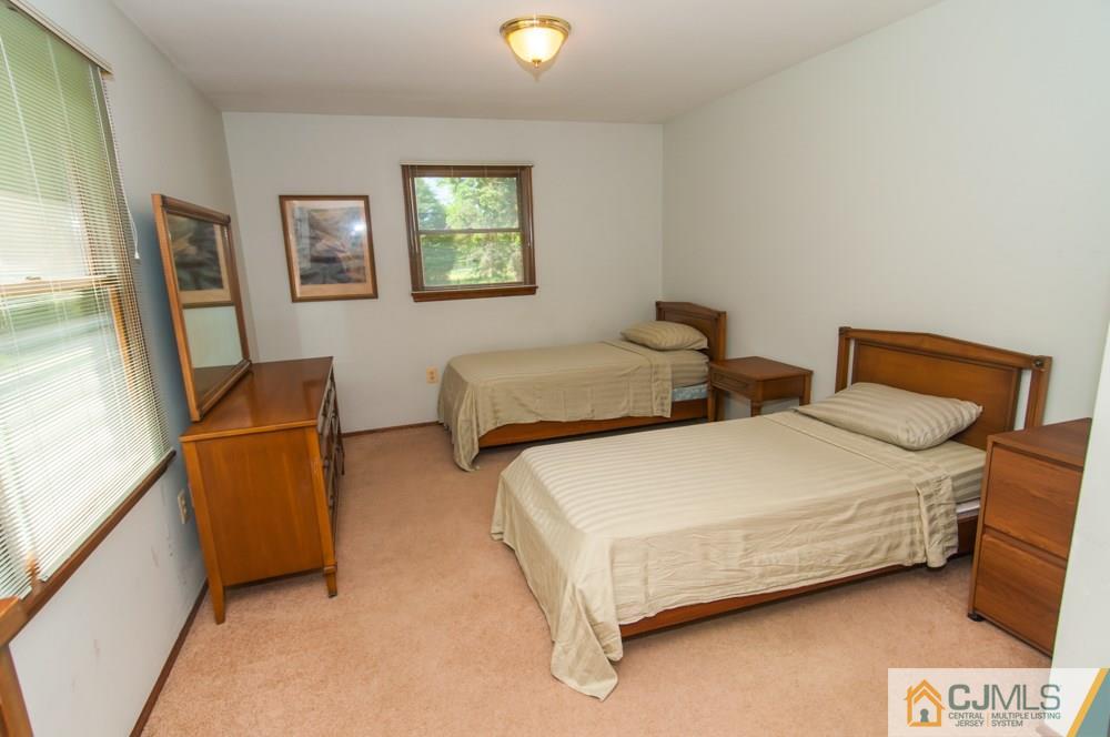 40 Higgins Road Old Bridge, NJ 08857 - Photo 26 of 46 a bedroom with two beds and a couch