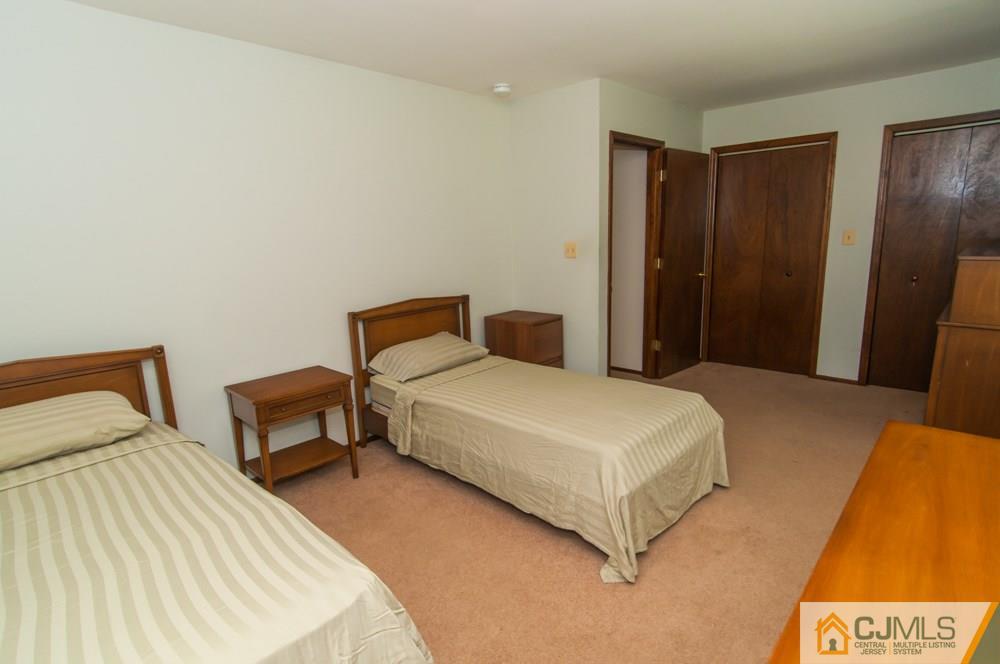 40 Higgins Road Old Bridge, NJ 08857 - Photo 27 of 46 a bedroom with a bed and a night stand