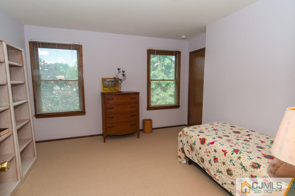 40 Higgins Road Old Bridge, NJ 08857 - Photo 28 of 46 a bedroom with a bed and a window
