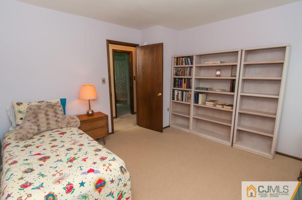 40 Higgins Road Old Bridge, NJ 08857 - Photo 30 of 46 a bedroom with a bed and a cabinets