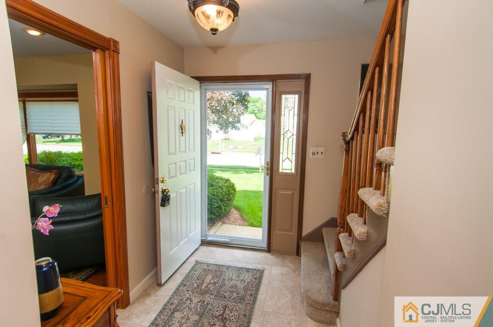 40 Higgins Road Old Bridge, NJ 08857 - Photo 4 of 46 a view of hallway with furniture and a window