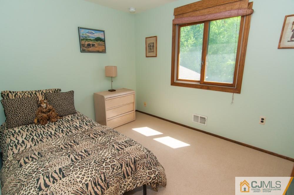 40 Higgins Road Old Bridge, NJ 08857 - Photo 34 of 46 a bedroom with a bed and window