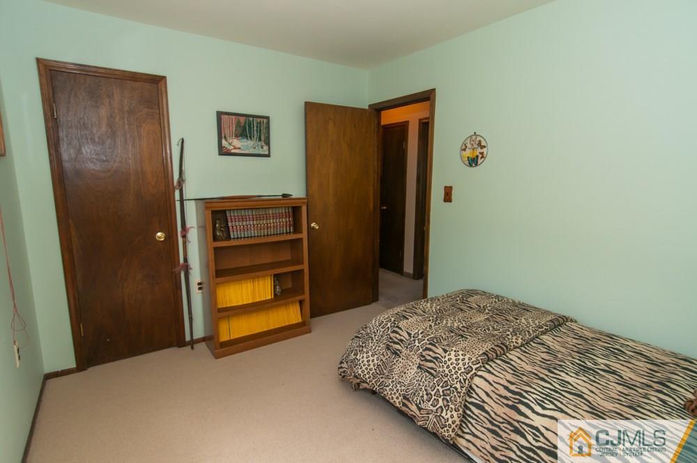 40 Higgins Road Old Bridge, NJ 08857 - Photo 35 of 46 a bedroom with a bed and a walk in closet