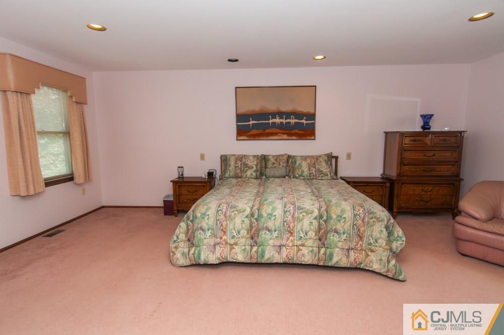 40 Higgins Road Old Bridge, NJ 08857 - Photo 38 of 46 a bedroom with a bed and a dresser