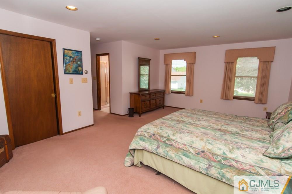 40 Higgins Road Old Bridge, NJ 08857 - Photo 39 of 46 a spacious bedroom with a bed and dresser