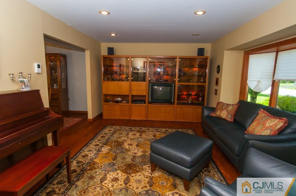 40 Higgins Road Old Bridge, NJ 08857 - Photo 5 of 46 a living room with furniture and a rug