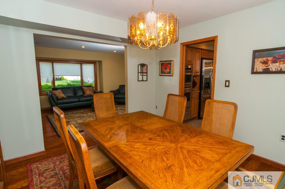40 Higgins Road Old Bridge, NJ 08857 - Photo 9 of 46 a view of a dining room with furniture and a chandelier