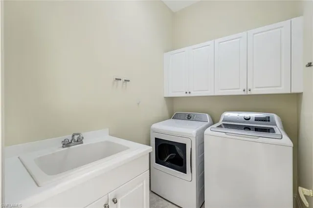 a view of green field with trees in the background