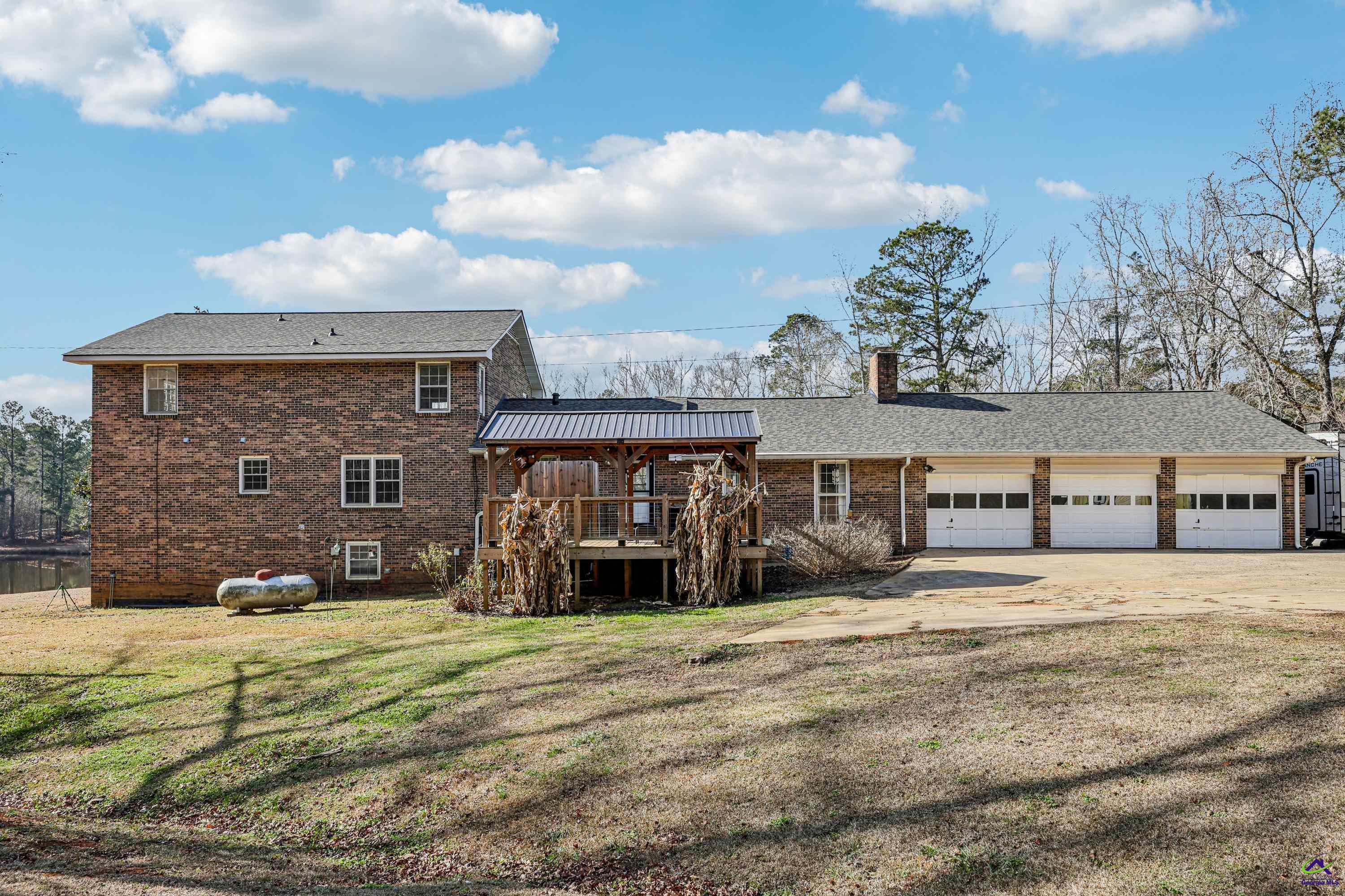 548 Greene Settlement Road Gray, GA 31032 - Photo 1 of 68 a front view of a house with a yard