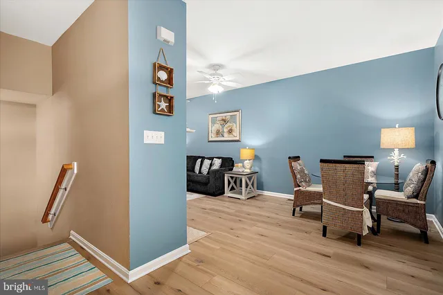 a kitchen with a stove a sink cabinets and a window