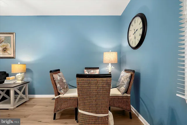 a kitchen with stainless steel appliances granite countertop a stove a sink and white cabinets