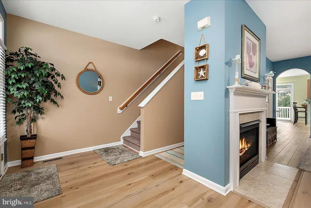 a kitchen with granite countertop sink window and white stainless steel appliances