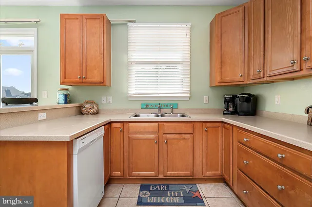 a view of a dining room with furniture a chandelier and wooden floor
