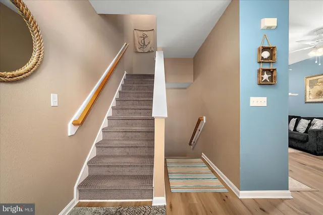 a bathroom with a tub a double vanity sink and mirror