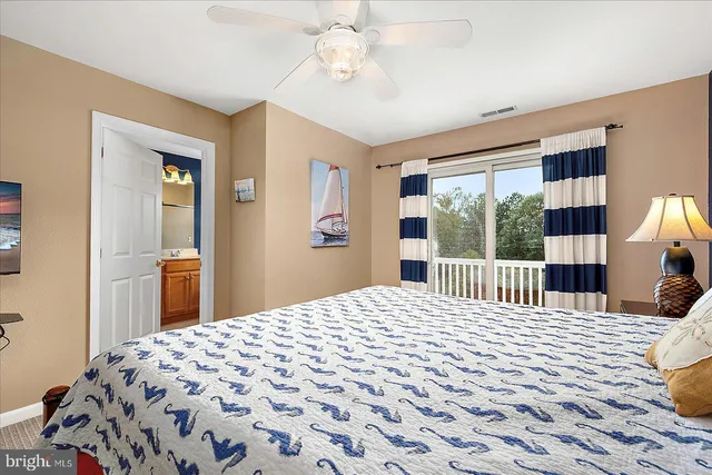 a bedroom with a bed and a night stand