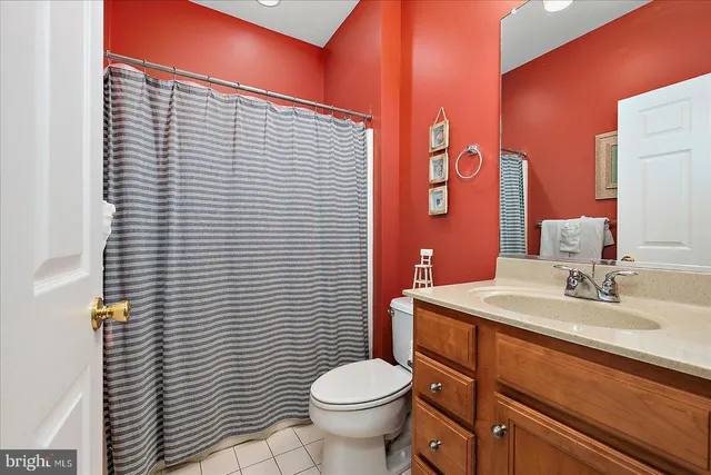 a view of a two chairs and table in the porch