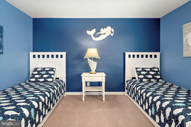 a front view of a house with yard and green space