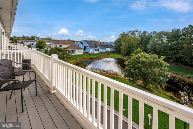 a view of stairs and yard with wooden floor and fence