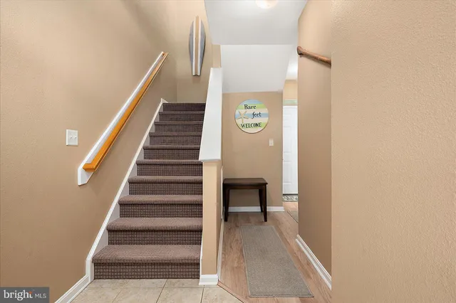 a view of a room with table and a window