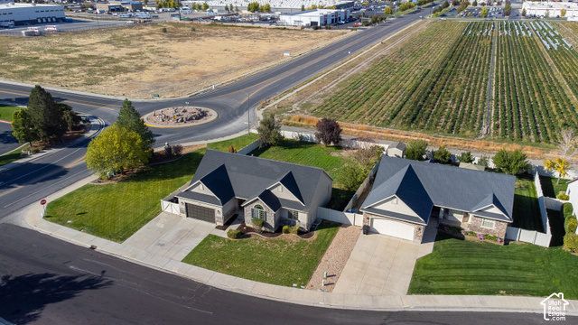 1742 Renaissance Way Springville, UT 84663 - Photo 22 of 23 Street-facing property with an attached two-car garage, concrete driveway, and a well-maintained lawn