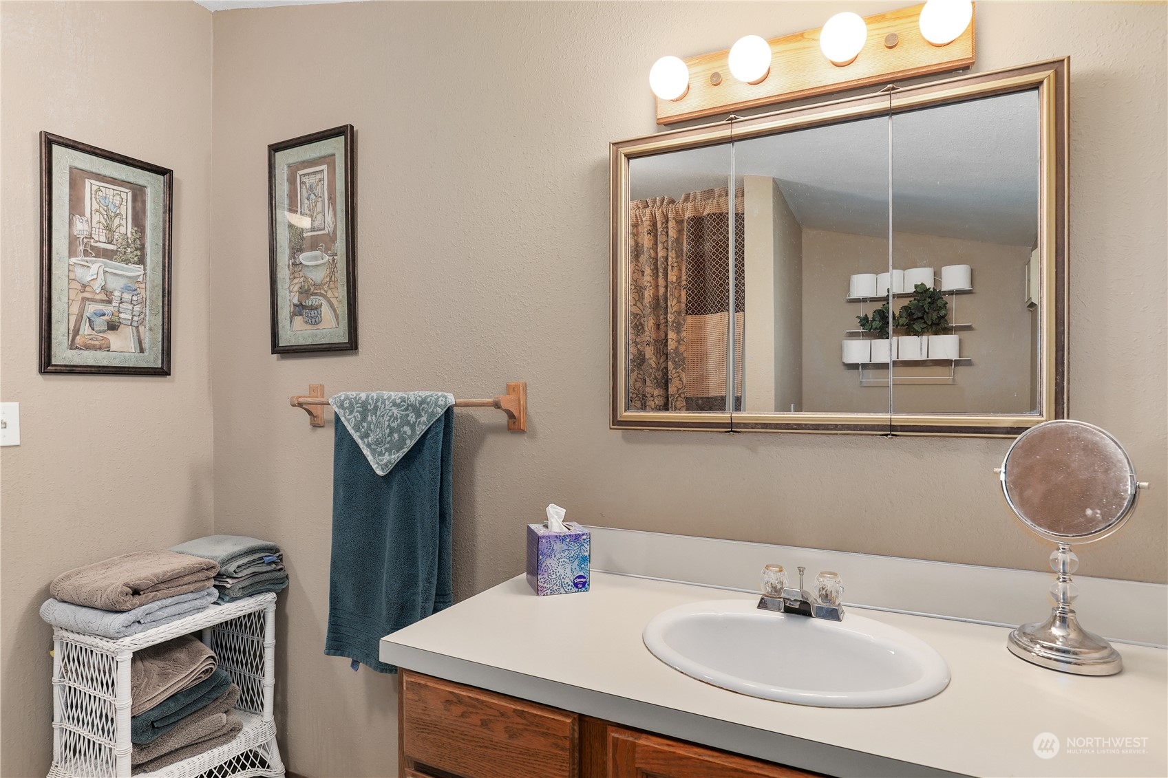 101 Northeast Sundstrom Road Belfair, WA 98528 - Photo 27 of 40 a bathroom with a sink and a mirror