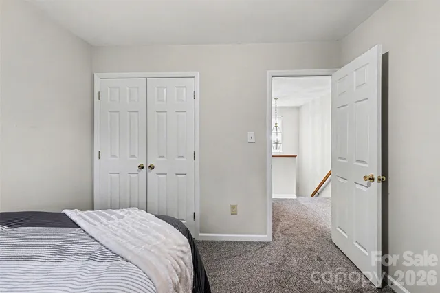a view of a bedroom from the hallway