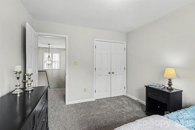 a bedroom with a bed and furniture