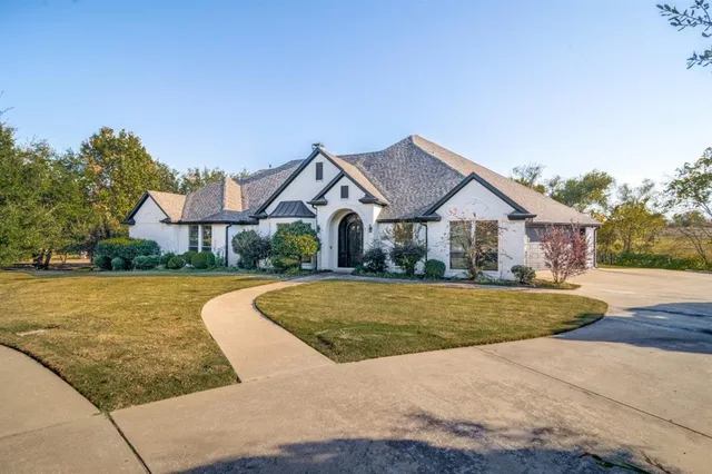 a front view of house with yard and swimming pool