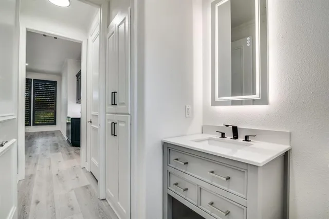 a bathroom with a sink and a mirror