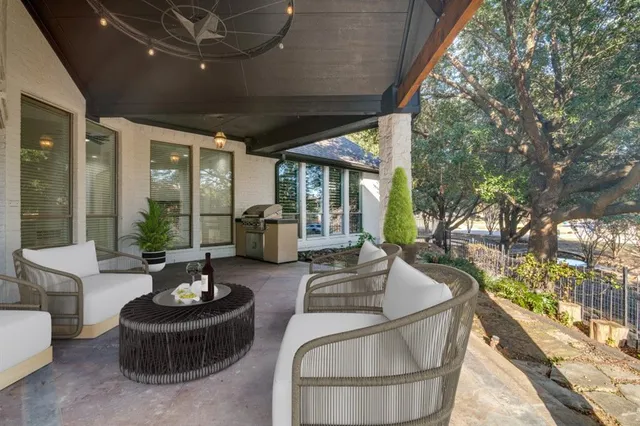 a building outdoor space with patio furniture and potted plants