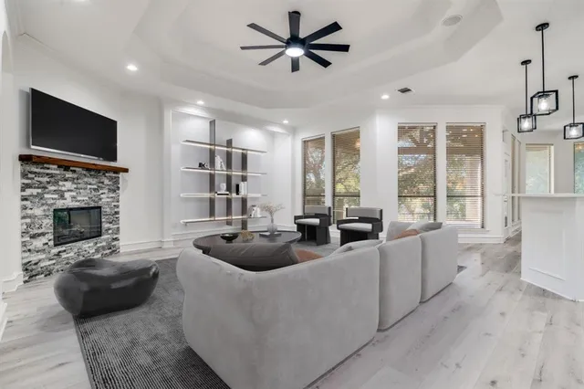 a living room with furniture and a fireplace