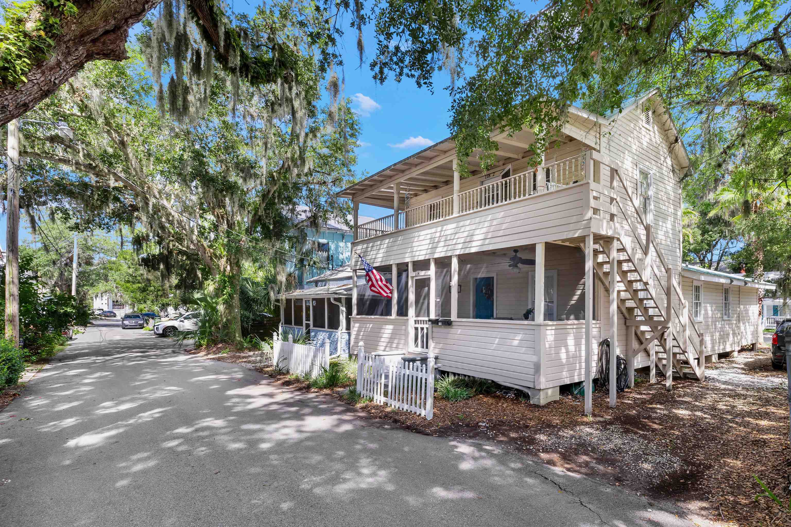118 Pomar Street St. Augustine, FL 32084 - Photo 1 of 23 a view of a house with a yard and large tree