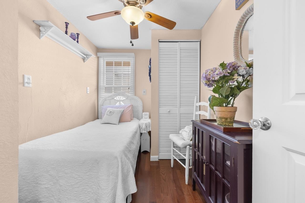 118 Pomar Street St. Augustine, FL 32084 - Photo 17 of 23 a bedroom with a bed and a potted plant