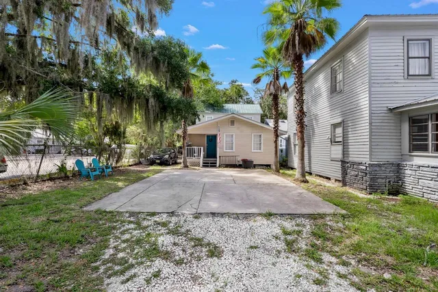 a house view with a backyard space
