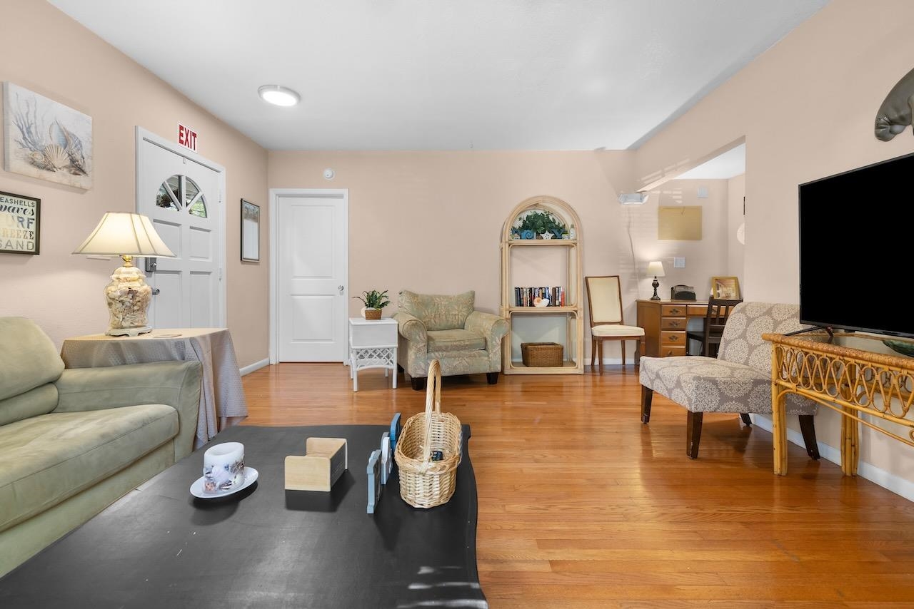 118 Pomar Street St. Augustine, FL 32084 - Photo 10 of 23 a living room with furniture and a flat screen tv
