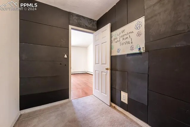 a kitchen with a refrigerator sink and cabinets